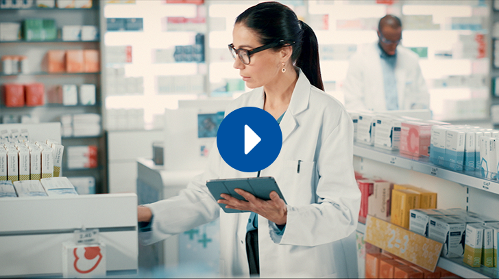 Thumbnail: Key video image of a pharmacist handing a product to a smiling female customer